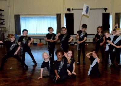 children performing in school hall