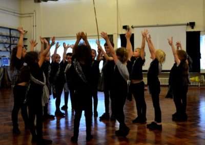 children performing in school hall